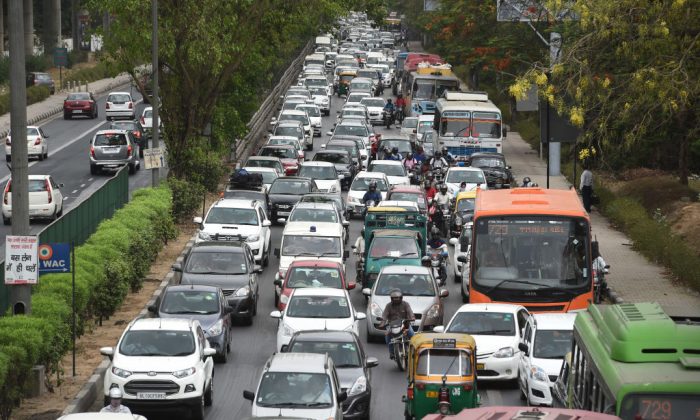 Indian commuters travel in a traffic jam on their way to Gurgaon from New Delhi on May 3, 2016.   
(Money Sharma/AFP/Getty Images)