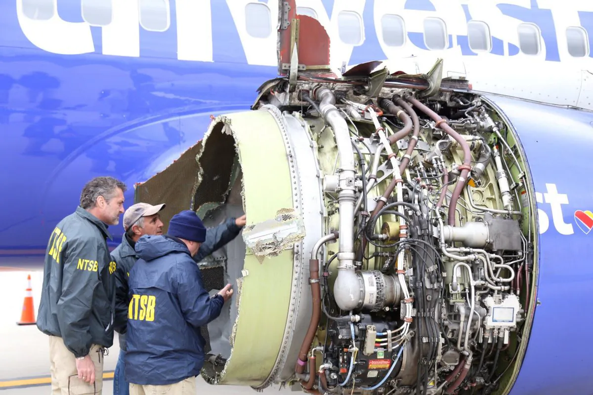 A U.S. NTSB investigator is on scene examining damage to the engine of the Southwest Airlines plane in this image released from Philadelphia, Pennsylvania, U.S., April 17, 2018. (NTSB/Handout via Reuters)