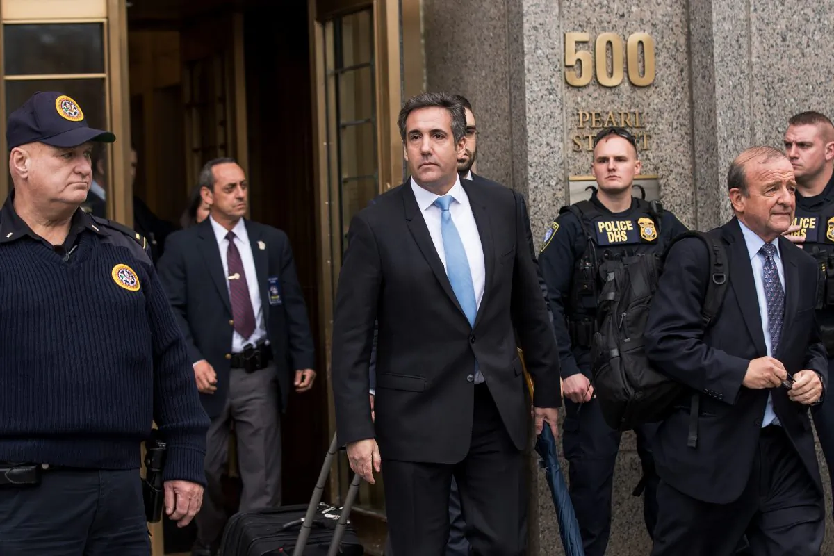 Michael Cohen (C), longtime personal lawyer and confidante for President Donald Trump, exits the United States District Court Southern District of New York, April 16, 2018 in New York City, after a hearing regarding the FBI’s raid on Cohen’s home, office, and hotel room (Drew Angerer/Getty Images)