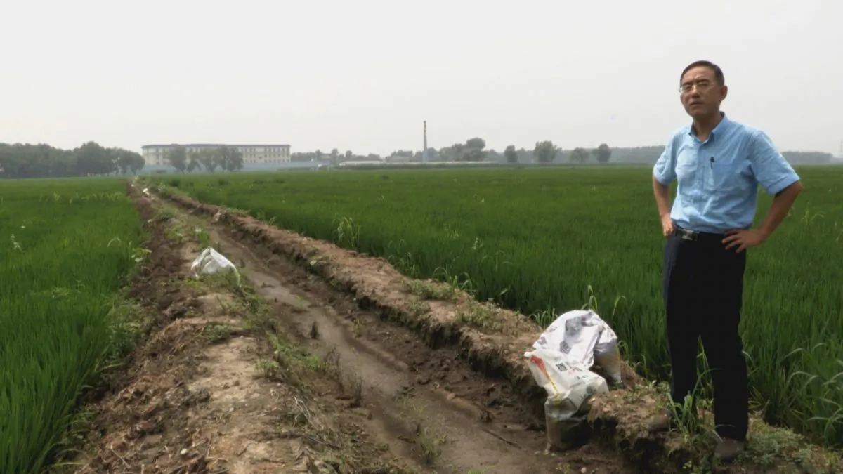 Sun Yi stands outside the now defunct Masanjia Labour Camp. (Courtesy Flying Cloud Productions)