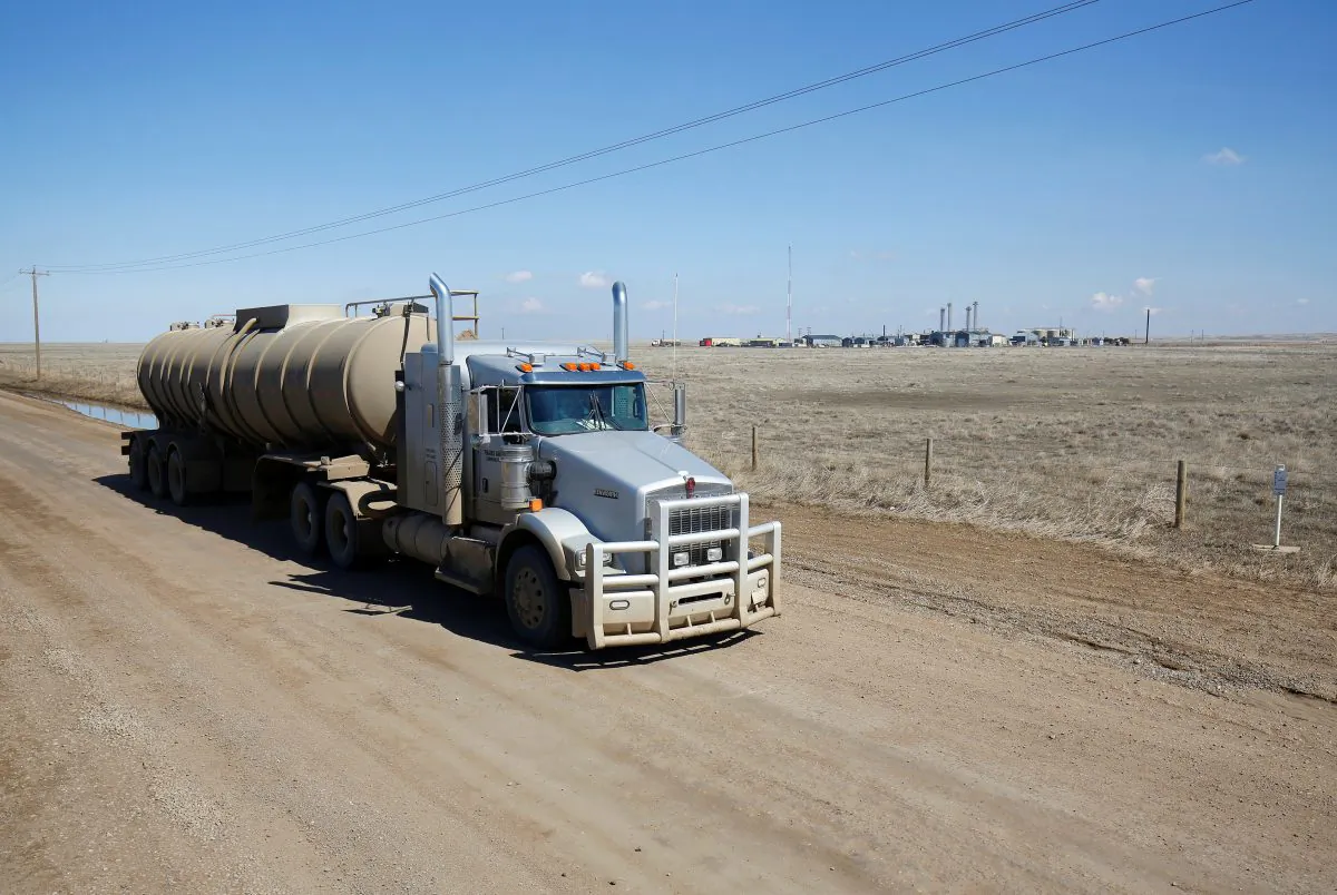 A tanker truck used to haul oil products drives away from an oil facility near Brooks, Alberta, Canada April 18, 2018.  (Reuters/Todd Korol)