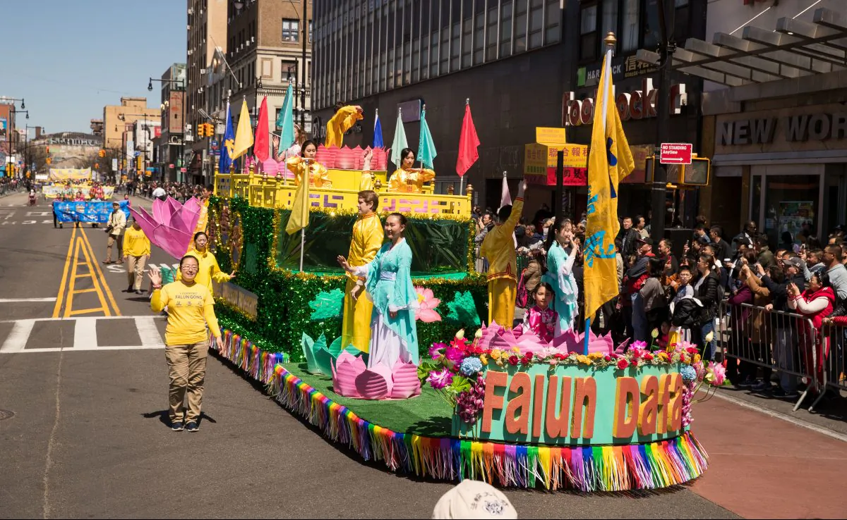 Falun Gong practitioners on a float at the parade in Flushing, Queens to commemorate the April 25, 1999 peaceful appeals, held on April 22, 2018. (Larry Dai/The Epoch Times)
