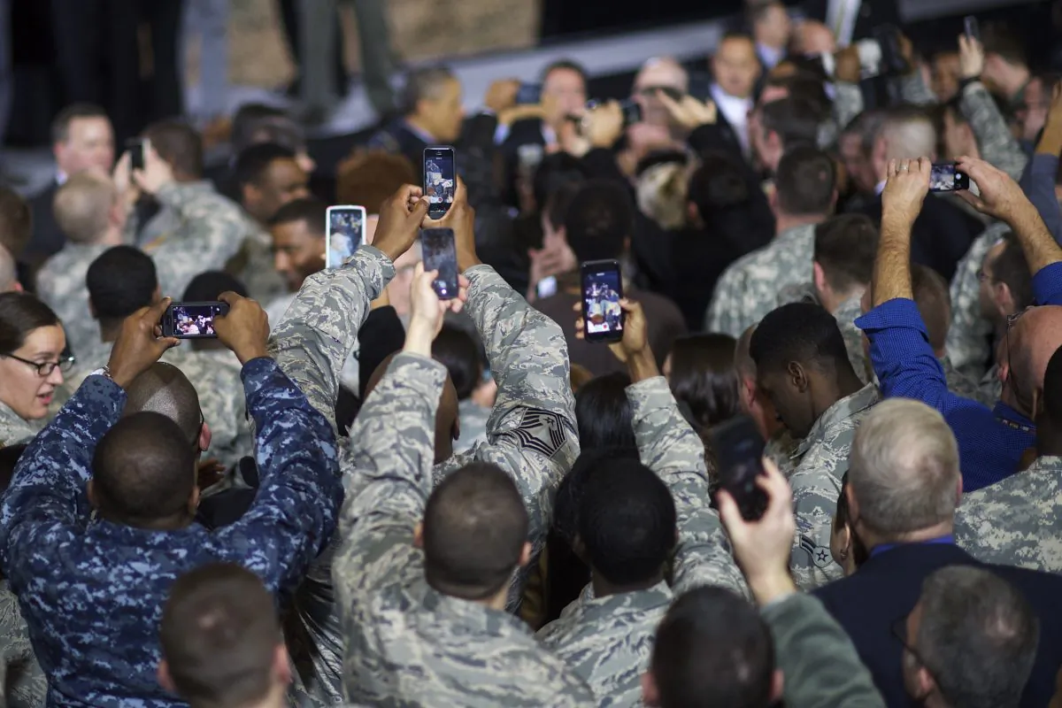 Members of U.S. armed forces try to record U.S. President Barack Obama with smartphones during an address in Dec. 15, 2014 at Joint Base McGuire-Dix-Lakehurst, New Jersey. (Mark Makela/Getty Images)