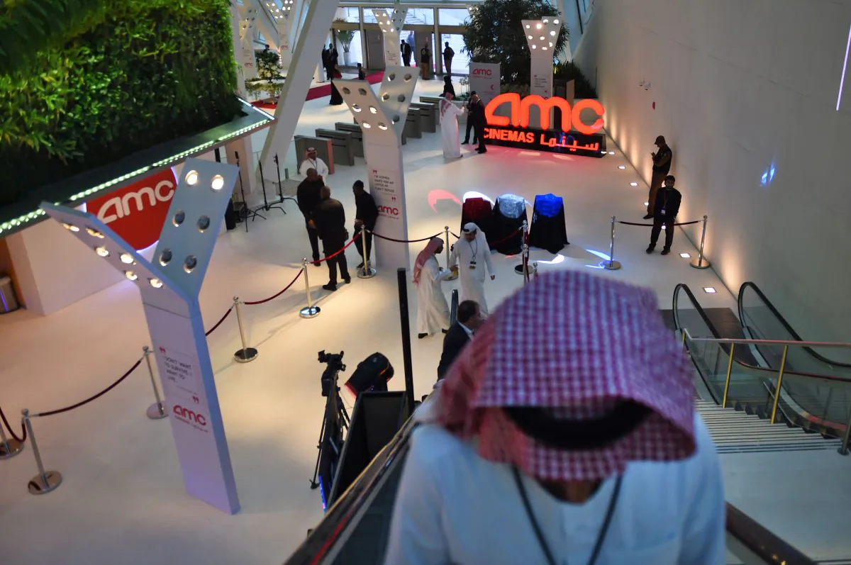 Saudi men take the escalator during a cinema test screening in Riyadh on April 18, 2018. The terrorist group ISIS has discussed on private communications about threatening the theater. (Fayez Nureldine/AFP/Getty Images)