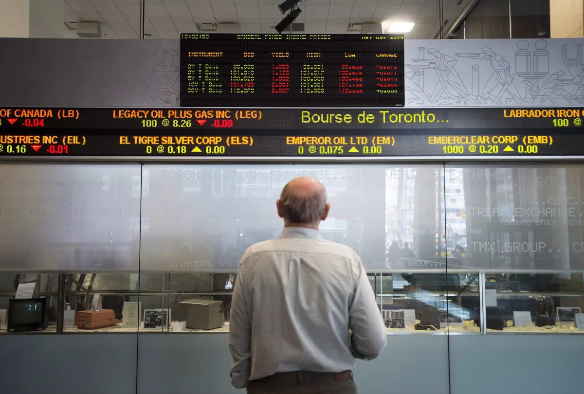 A man watches the financial markets at the TMX Group in Toronto's financial district in this file photo. (The Canadian Press/Darren Calabrese)