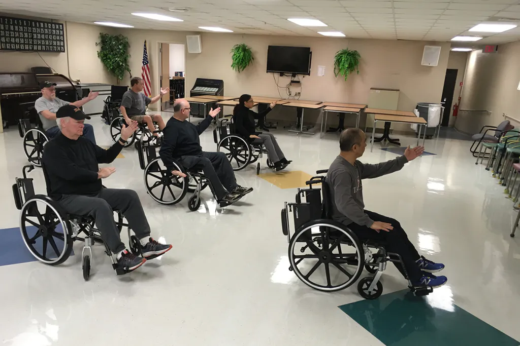 Veterans in Murfreesboro, Tenn., enjoy a wheelchair tai chi class. Other alternative health programs now commonly offered at VA hospitals in the United States include yoga, mindfulness training, and art therapy. (Blake Farmer/Nashville Public Radio)
