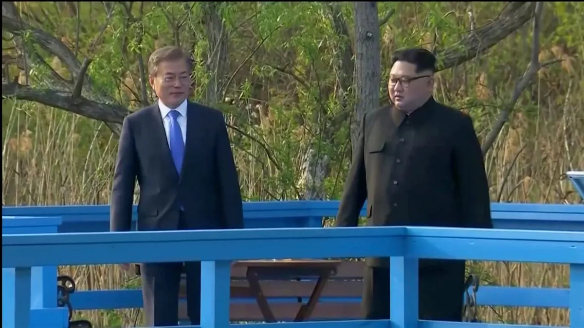 South Korean President Moon Jae-in and North Korean leader Kim Jong Un talk during the inter-Korean summit at the truce village of Panmunjom, in this still frame taken from video, South Korea April 27, 2018. (Host Broadcaster via Reuters TV)
