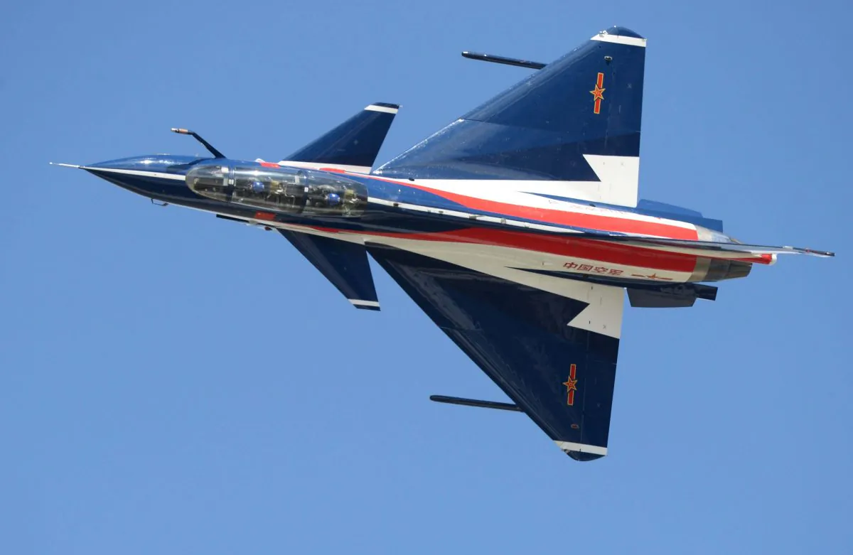 The Chinese regime's J-10 fighter jet performs at an airshow in Changchun, Jilin province of China on Sept. 12, 2015. The jet includes technology stolen from the United States. (STR/AFP/Getty Images)