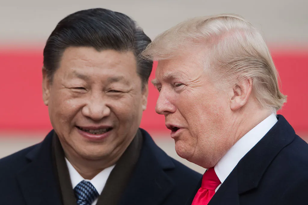 Chinese leader Xi Jinping (L) and US President Donald Trump attend a welcome ceremony at the Great Hall of the People in Beijing on Nov. 9. (Nicolas Asfouri/AFP/Getty Images)