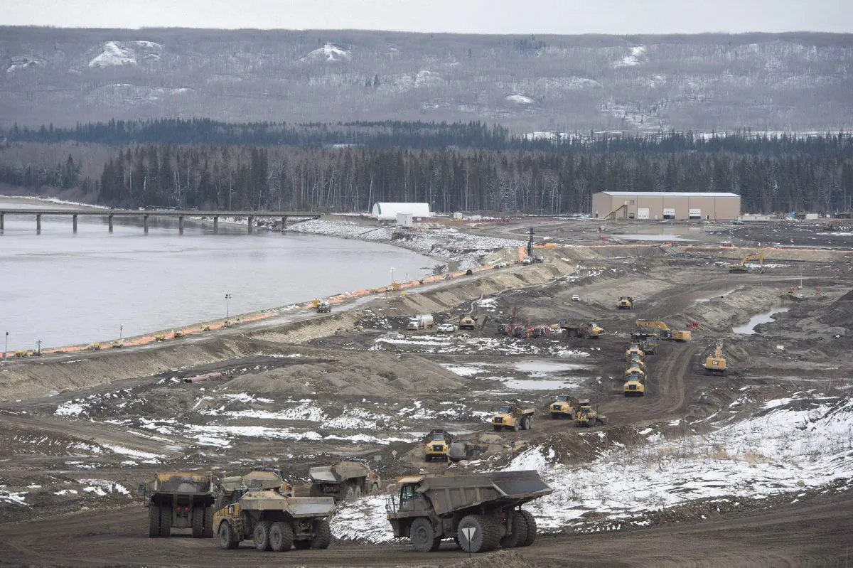 The Site C Dam location is seen along the Peace River in Fort St. John, B.C., on April 18, 2017. A partnership led by Aecon Group Inc. has been chosen as the preferred proponent by B.C. Hydro for a Site C generating station and spillways civil works contract. (The Canadian Press/Jonathan Hayward)