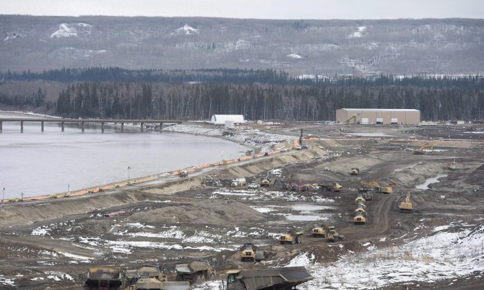 The Site C Dam location is seen along the Peace River in Fort St. John, B.C., on April 18, 2017. A partnership led by Aecon Group Inc. has been chosen as the preferred proponent by B.C. Hydro for a Site C generating station and spillways civil works contract. (The Canadian Press/Jonathan Hayward)