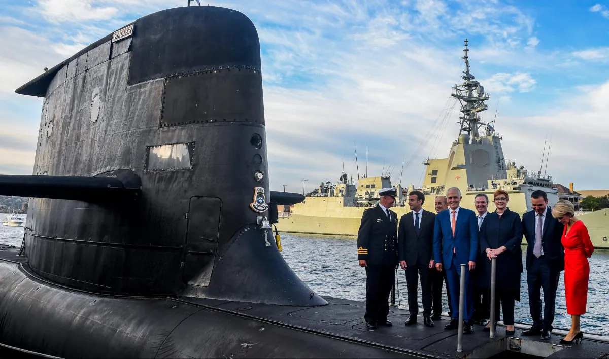Former Australian Prime Minister Malcolm Turnbull, President of France Emmanuel Macron, along with Australian ministers on the submarine HMAS Waller at Garden Island, in Sydney May 2, 2018. (AAP/Brendan Esposito/via Reuters)