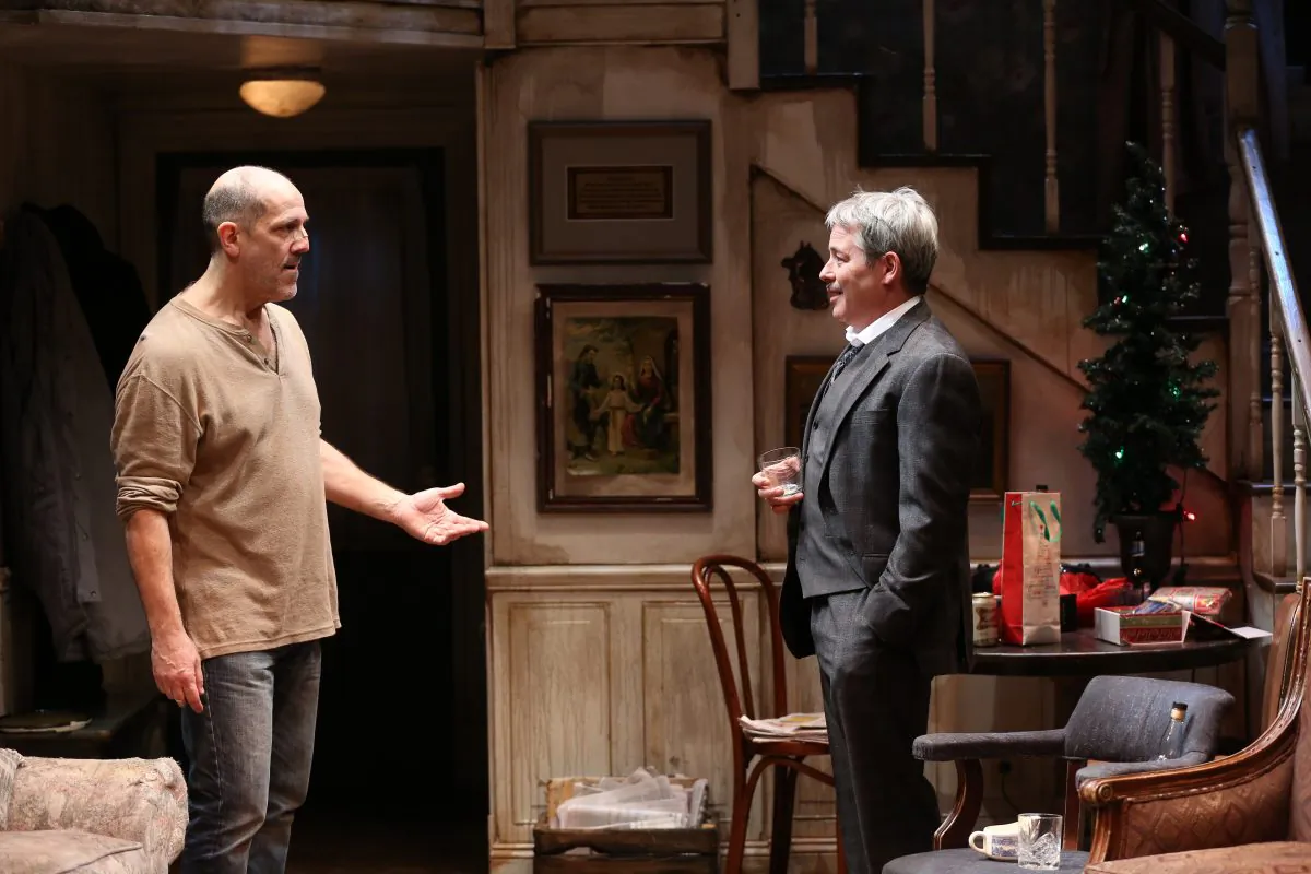 “Sharky”Harkin (Andy Murray, L) meets his reckoning in the mysterious stranger Mr. Lockhart who’s come to call, in Conor McPherson's drama "The Seafarer." (Carol Rosegg)