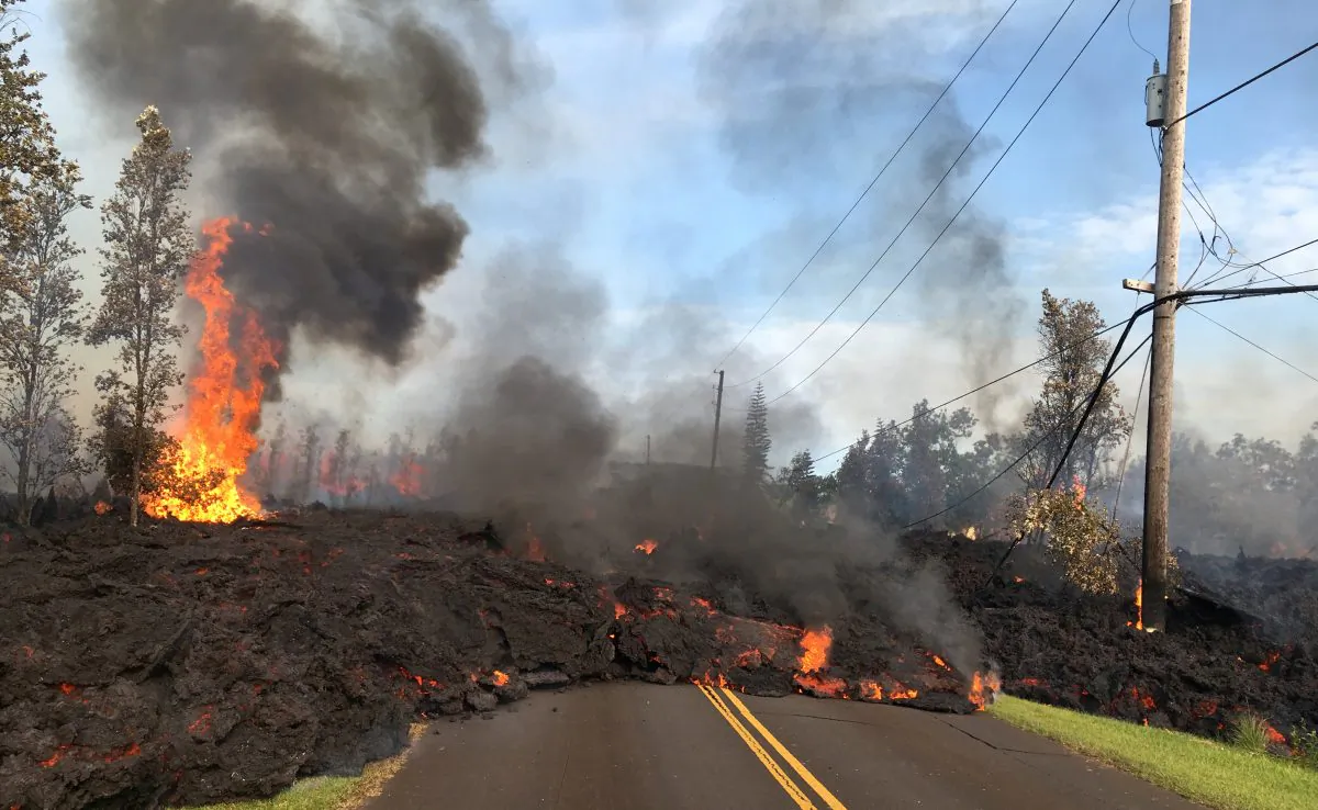 Lava advances along a street near a fissure in Leilani Estates, on Kilauea Volcano's lower East Rift Zone, Hawaii, the U.S., May 5, 2018. (U.S. Geological Survey/Handout via Reuters)