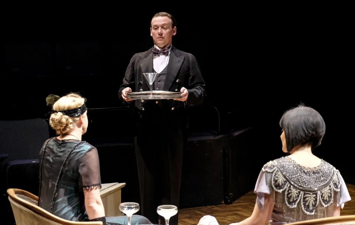 At the start of “A Brief History of Women,” Antony Eden plays 17-year-old Tony Spates, serving at a party of the wealthy Lady Kirkbridge (Frances Marshall, L) and her daughter (Laura Matthews). (Tony Bartholomew)