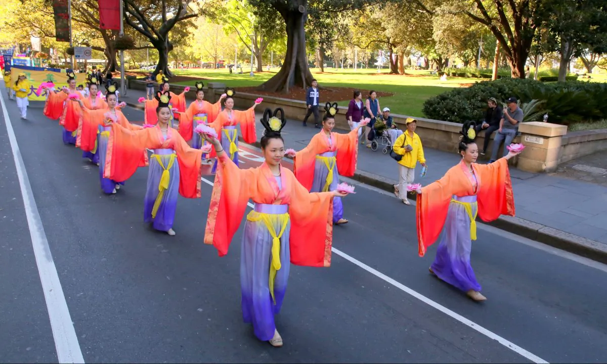Sydney Falun Dafa practitioners participate in a World Falun Dafa Day parade in Sydney on May 5, 2018. Falun Dafa is a Buddha-school practice based on the universal principles of Truthfulness, Compassion and Forbearance. (Linda Zhang/The Epoch Times)