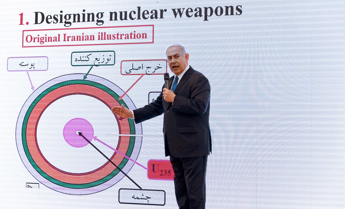 Israeli Prime Minister Benjamin Netanyahu delivers a speech on Iran's nuclear program at the defense ministry in Tel Aviv
