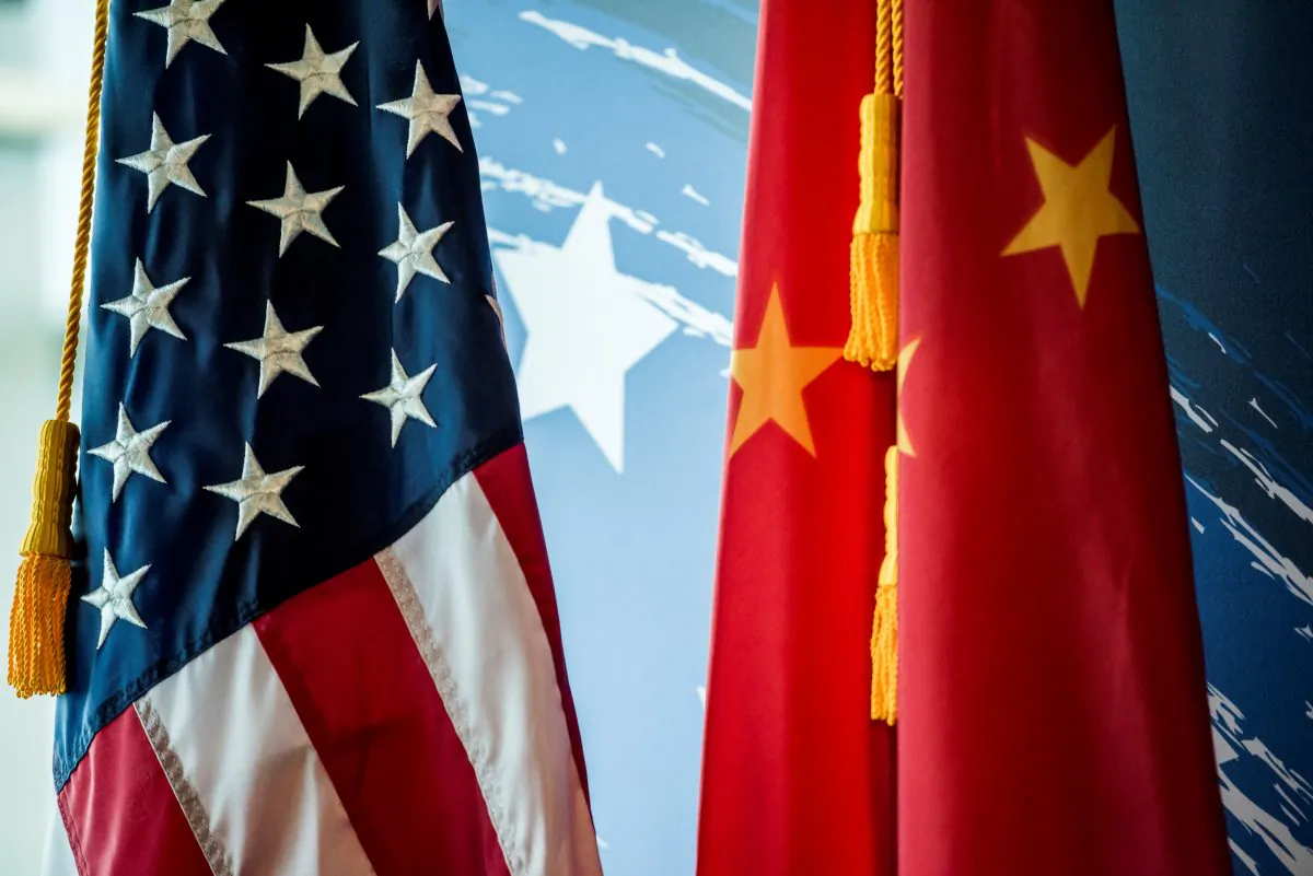 The U.S. and Chinese flags are seen during a promotional event in Beijing on June 30, 2017. (Fred Dufour/AFP/Getty Images)