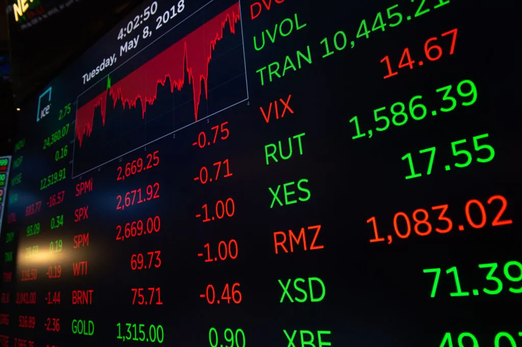 The closing numbers are displayed after the closing bell of the Dow Industrial Average at the New York Stock Exchange on May 8. Public companies are handcuffed by the existing regulatory system, with excessive rules hindering their growth. (BRYAN R. SMITH/AFP/Getty Images)
