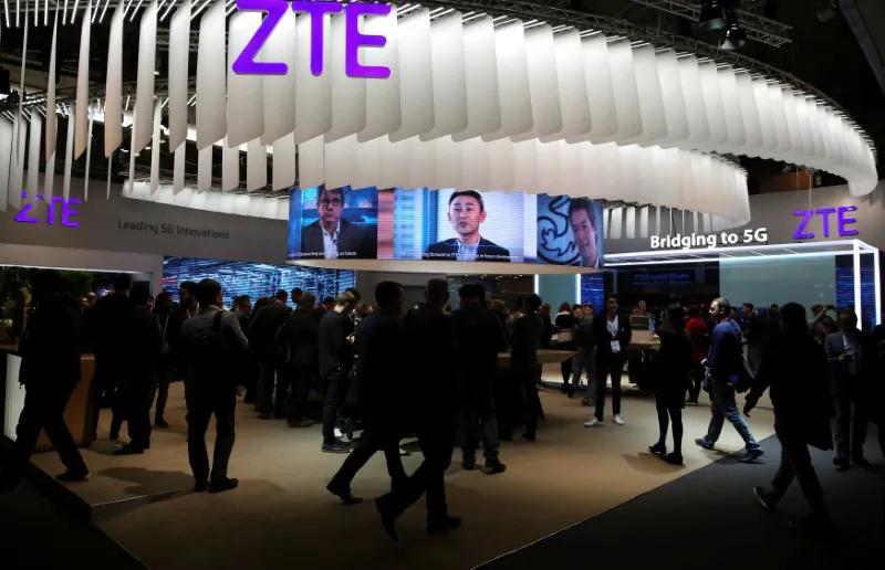 People stand at ZTE's booth during the Mobile World Congress in Barcelona, Spain, on February 27, 2017. (Paul Hanna/File Photo/Reuters)