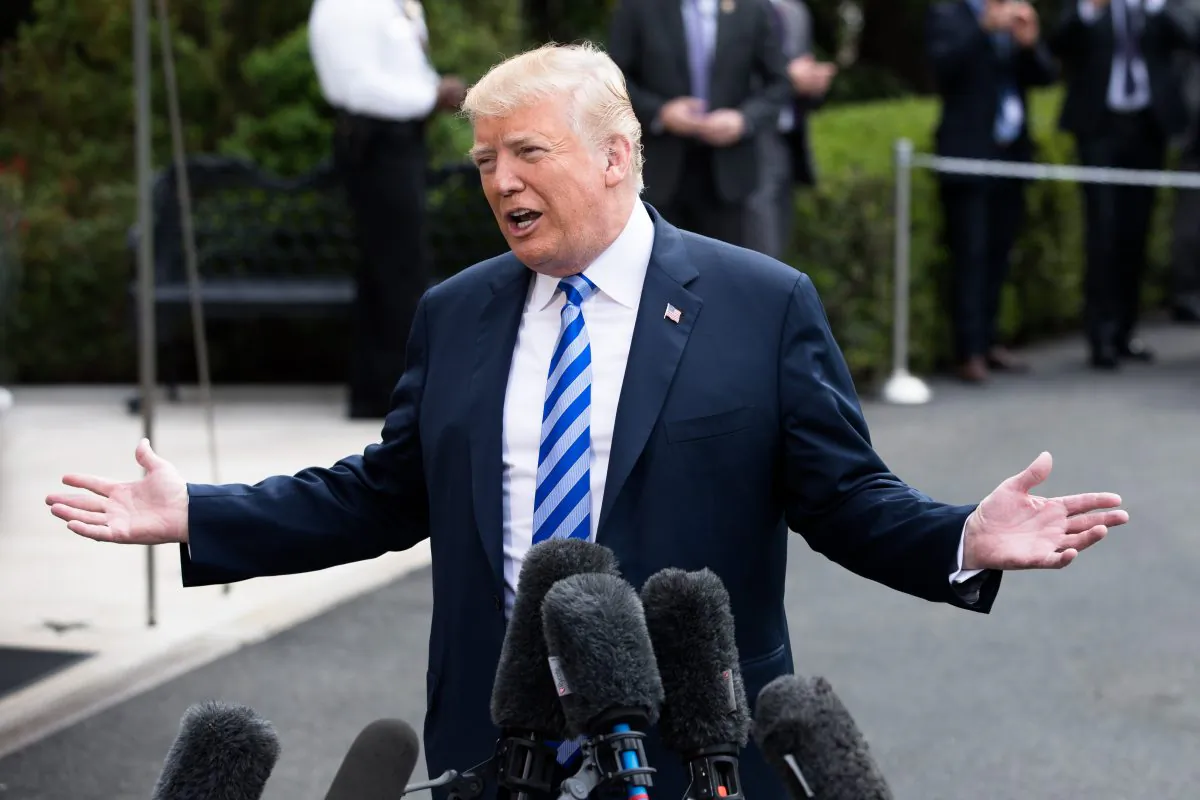 President Donald Trump talks to the media before boarding Marine One on the South Lawn of the White House in Washington en route to Dallas, Texas, where he will give remarks at the National Rifle Association Leadership Forum on May 4, 2018. (Samira Bouaou/The Epoch Times)