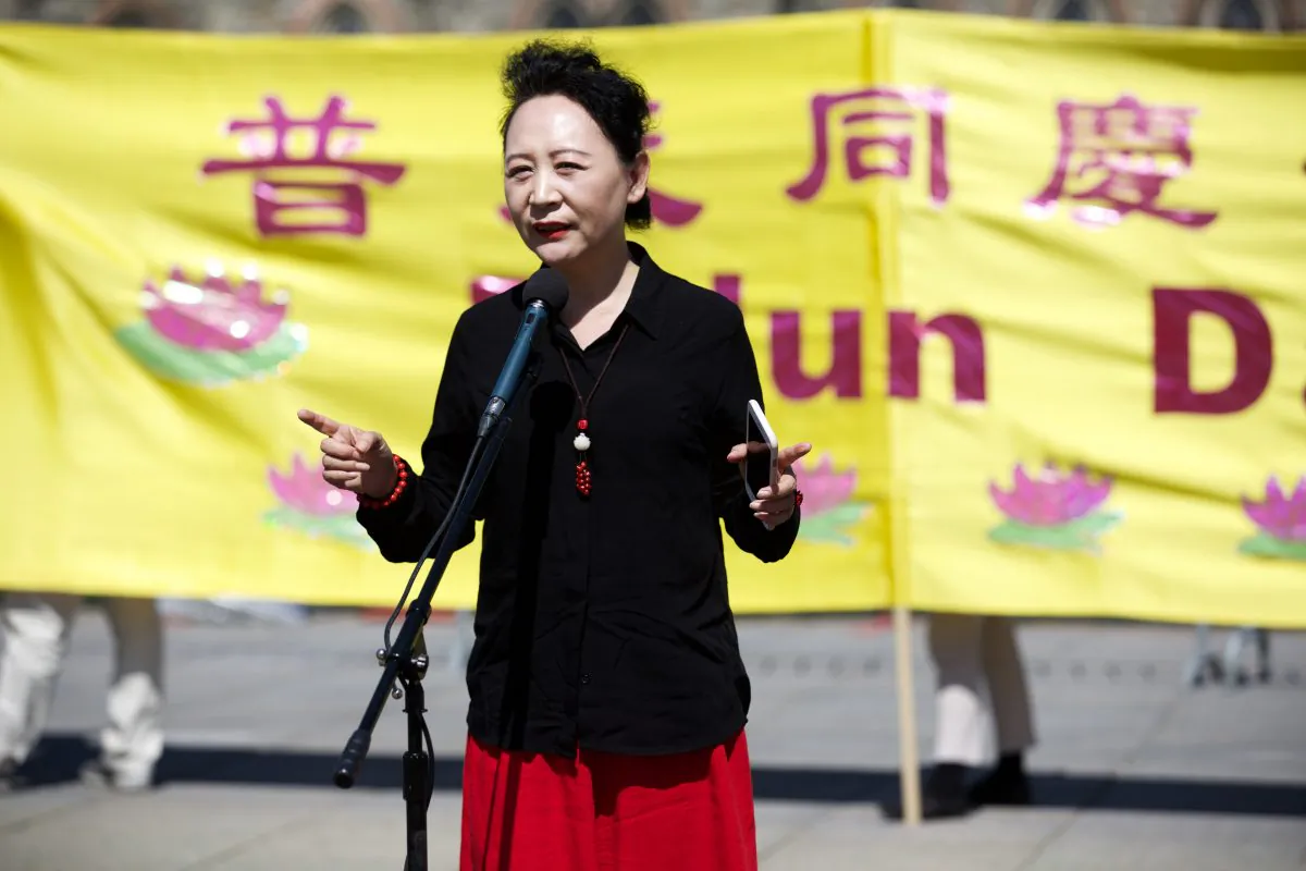 Activist Sheng Xue addresses the crowd celebrating the Falun Dafa Day on the Parliament Hill in Ottawa on May 9, 2018. (Evan Ning/The Epoch Times)