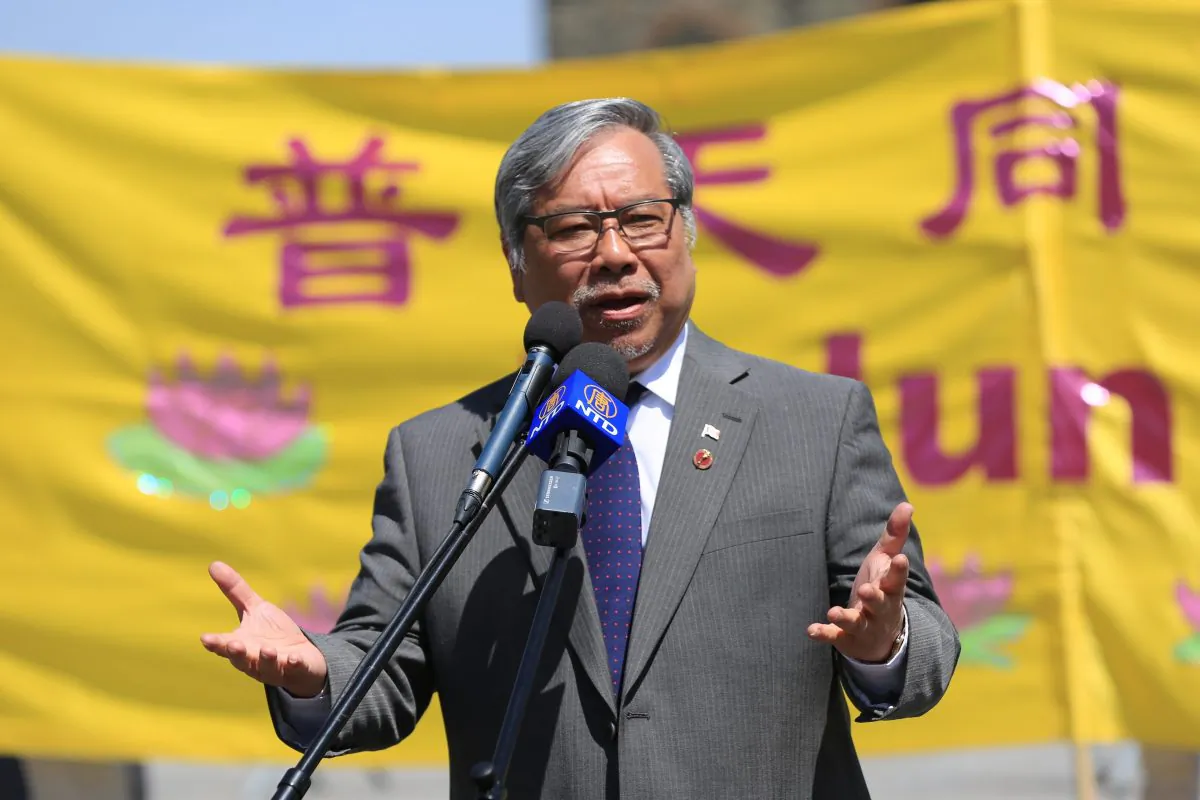 Senator Thanh Hai Ngo addresses the crowd celebrating Falun Dafa Day on Parliament Hill in Ottawa on May 9, 2018. Ngo is one of the parliamentarians calling on the Canadian government to apply Magnitsky sanctions against Chinese officials for human rights abuses in China.(Jonathon Ren/The Epoch Times)