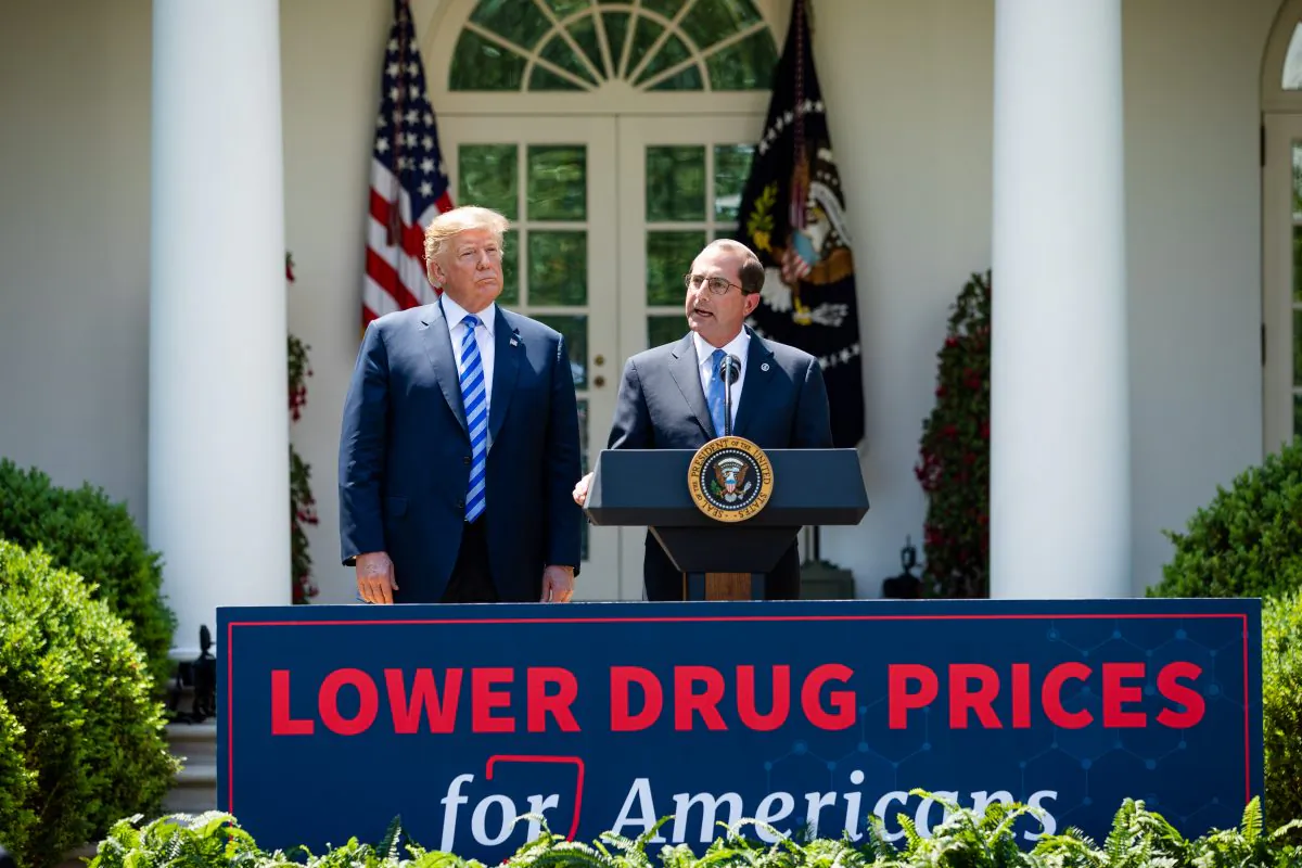 President Donald Trump (L) and Secretary of Health and Human Services Alex Azar give remarks on lowering drug prices in the Rose Garden of the White House in Washington on May 11, 2018. (Samira Bouaou/The Epoch Times)