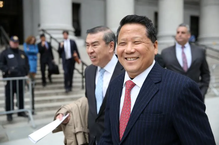 Macau billionaire and real estate developer Ng Lap Seng (R), who was recently sentenced to four years imprisonment for bribery, exits the Manhattan U.S. District Court in New York, U.S., on  April 7, 2017. (Ashlee Espinal/Reuters)