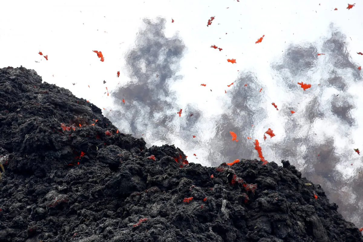 Lava erupts from a fissure east of the Leilani Estates subdivision during ongoing eruptions of the Kilauea Volcano in Hawaii, U.S., May 12, 2018. (Reuters/Terray Sylvester)