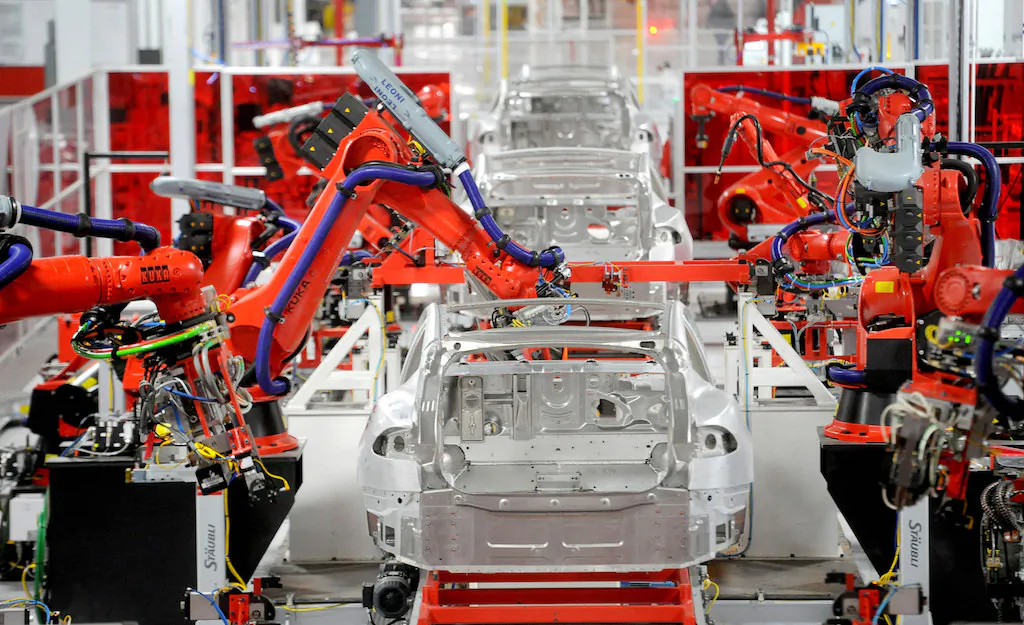 Robotic arms assemble Tesla's Model S sedans at the company's factory in Fremont, Calif., on June 22, 2012. (REUTERS/Noah Berger/File Photo)