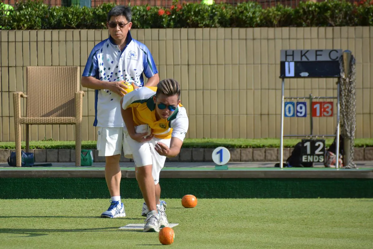 Jordi Lo (delivering) from Craigengower Cricket Club on his way to defeating Hong Kong Football Club’s CT Wong in the second league match of the 2018 season. CCC won 6-2 and moved to top of the table, on Saturday May 12, 2018. (Stephanie Worth)