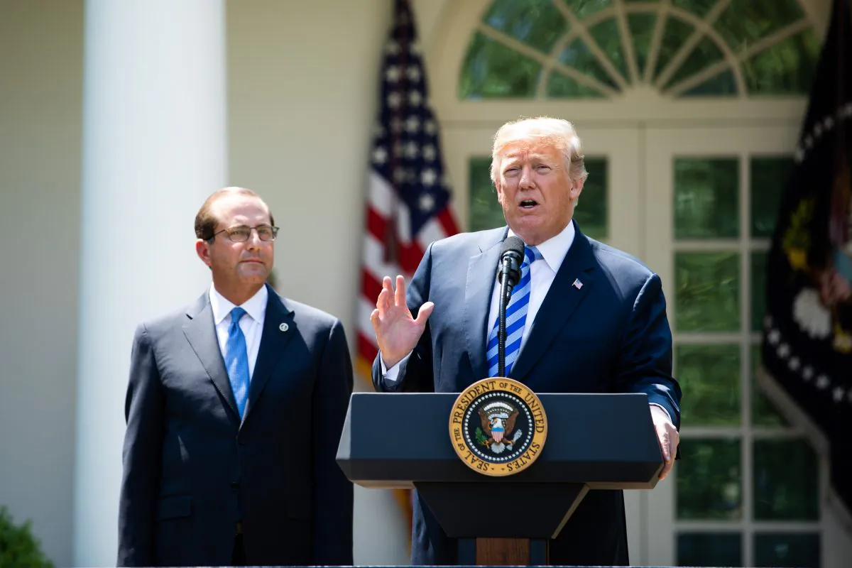 President Donald Trump and Secretary of Health and Human Services Alex Azar give remarks on lowering drug prices in the Rose Garden of the White House on May 11.  (Samira Bouaou/The Epoch Times)