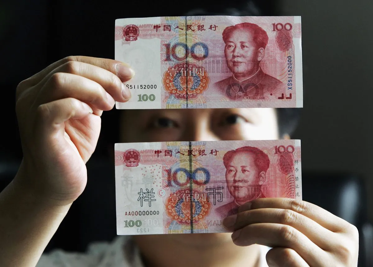 This undated photo shows 100 yuan notes at a bank in Shanghai, China. (China Photos/Getty Images)