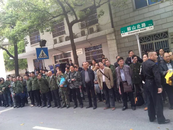 This undated mobile phone picture shows former soldiers participating in a protest outside the provincial government building in Changsha, central China's Hunan province. Marginalised and misunderstood, Chinese Vietnam veterans -- who fought in a little-celebrated war with its southern neighbor -- risk beatings and prison in a new battle with the CCP officials. (STR/AFP/Getty Images)