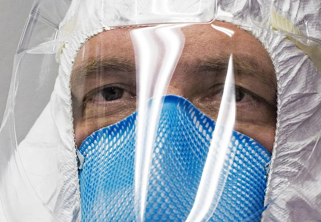 A member of a medical team is seen inside a Containerized Bio-Containment System (CBCS) during a shake-down exercise at Dulles International Airport in Virginia, outside Washington, DC on Nov. 18, 2016 after return with simulated patients infected with Ebola from West Africa.
(Paul J. Richards/AFP/Getty Images)