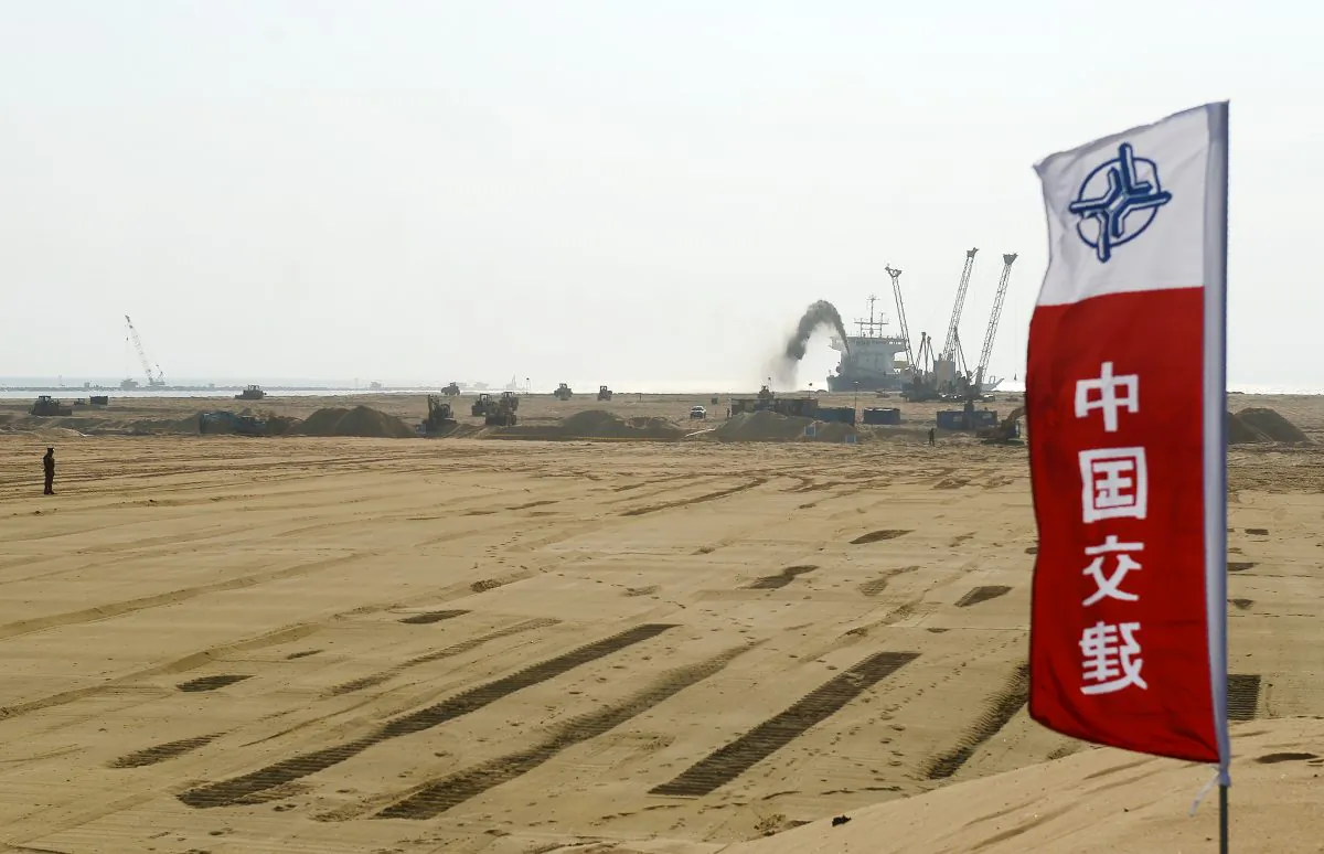 Pumps dredging sand at the site of a Chinese-funded $1.4 billion reclamation project next to the Colombo main sea port on January 2, 2018. China has several infrastructure projects planned as part of its "One Belt, One Road" initiative for spreading its geopolitical influence. (Lakruwan Wanniarachchi/AFP/Getty Images)
