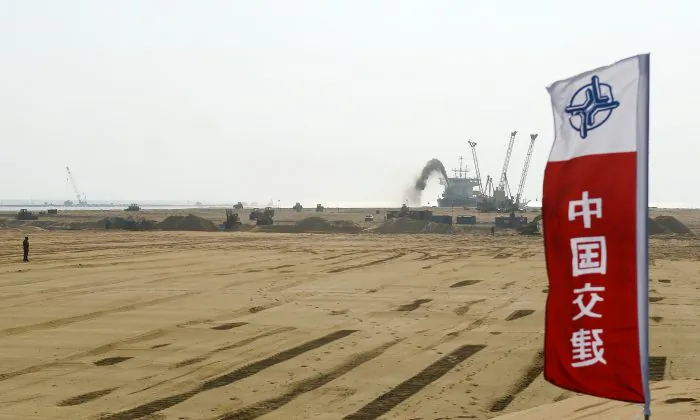 Pumps dredging sand at the site of a Chinese-funded $1.4 billion reclamation project next to the Colombo main sea port on January 2, 2018. China has several infrastructure projects planned as part of its "One Belt, One Road" initiative for spreading its geopolitical influence. (Lakruwan Wanniarachchi/AFP/Getty Images)