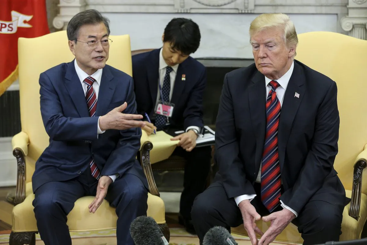 South Korean President Moon Jae-in speaks as President Donald Trump listens during a meeting in the Oval Office of the White House in Washington DC on May 22, 2018. (Oliver Contreras-Pool/Getty Images)