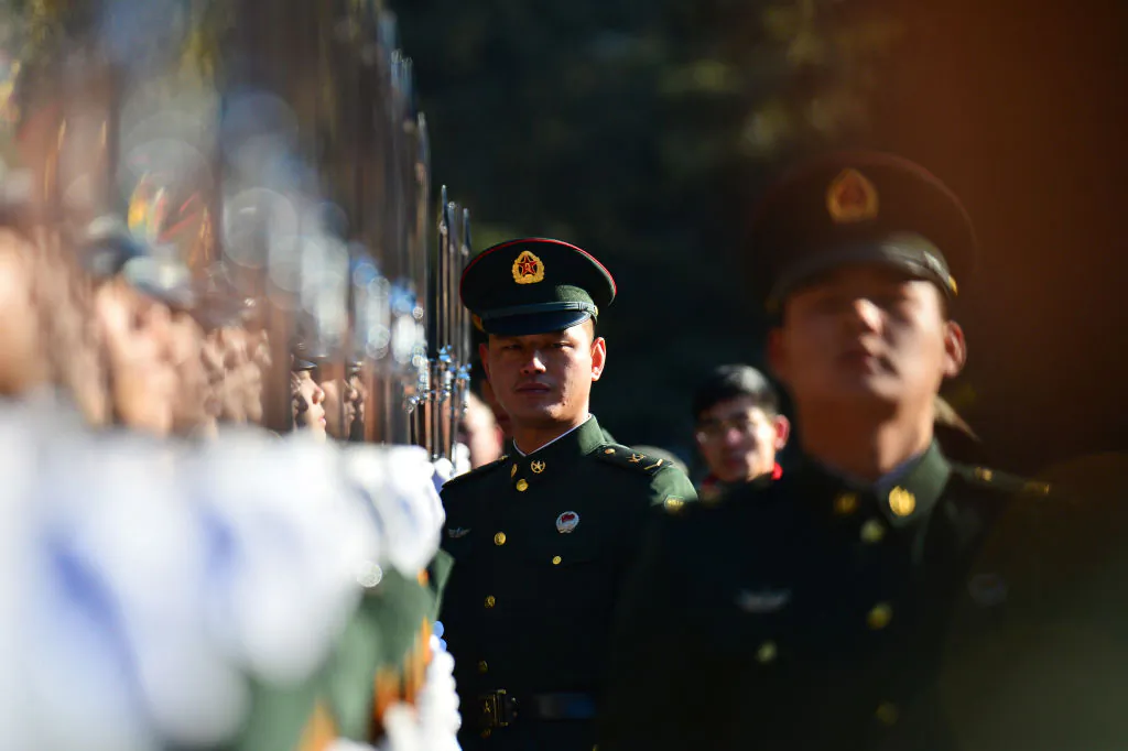 Soldiers in the Chinese regime's People's Liberation Army hold a training on Jan. 1, 2018. (-/AFP/Getty Images)