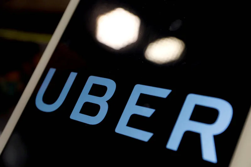 The logo of Uber is seen on an iPad, during a news conference to announce Uber resumes ride-hailing service, in Taipei, Taiwan April 13, 2017. (Reuters/Tyrone Siu/File Photo)