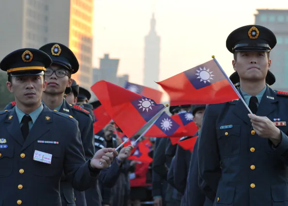 Participants wave the Taiwan’s flag during a flag-raising ceremony at the Presidential Office Square in Taipei on Jan, 1, 2014. (Mandy Cheng/AFP/Getty Images)
