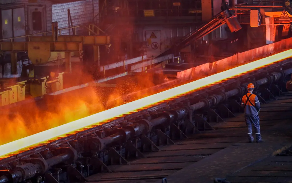 A red-hot steel plate passes through a press at the ArcelorMittal steel plant in Ghent, Belgium,  on May 22, 2018. (Yves Herman/File Photo/Reuters)