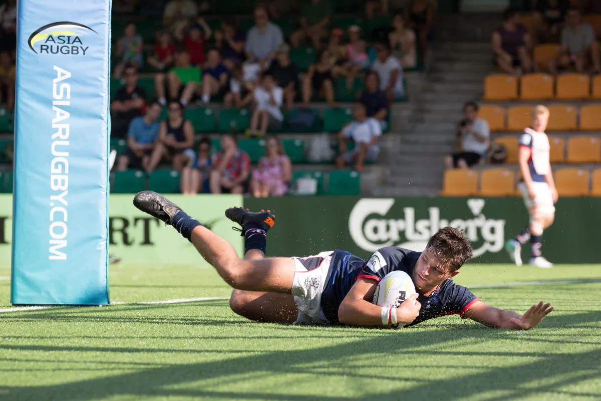 Hong Kong’s scrumhalf Jamie Lauder scores between the posts on his way to posting two trys in the Asian Championship match between Hong Kong and Malaysia at the Hong Kong Football Club on Saturday May 26, 2018. (Dan Marchant)