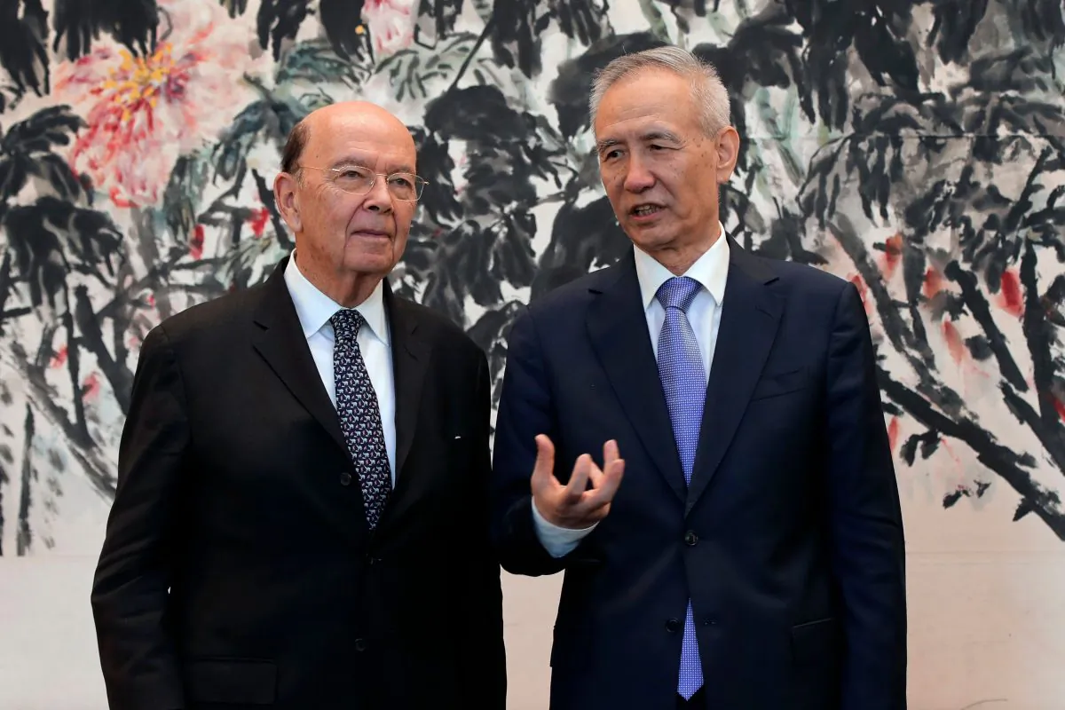 U.S. Commerce Sec. Wilbur Ross (L) chats with Chinese Vice Premier Liu He after their trade meeting in Beijing on June 3. (Andy Wong/AFP/Getty Images)