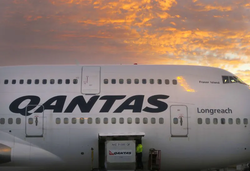 A worker unloads a Qantas Airways Boeing 747 at Sydney's International airport in Australia on June 24, 2017. (David Gray/Reuters)