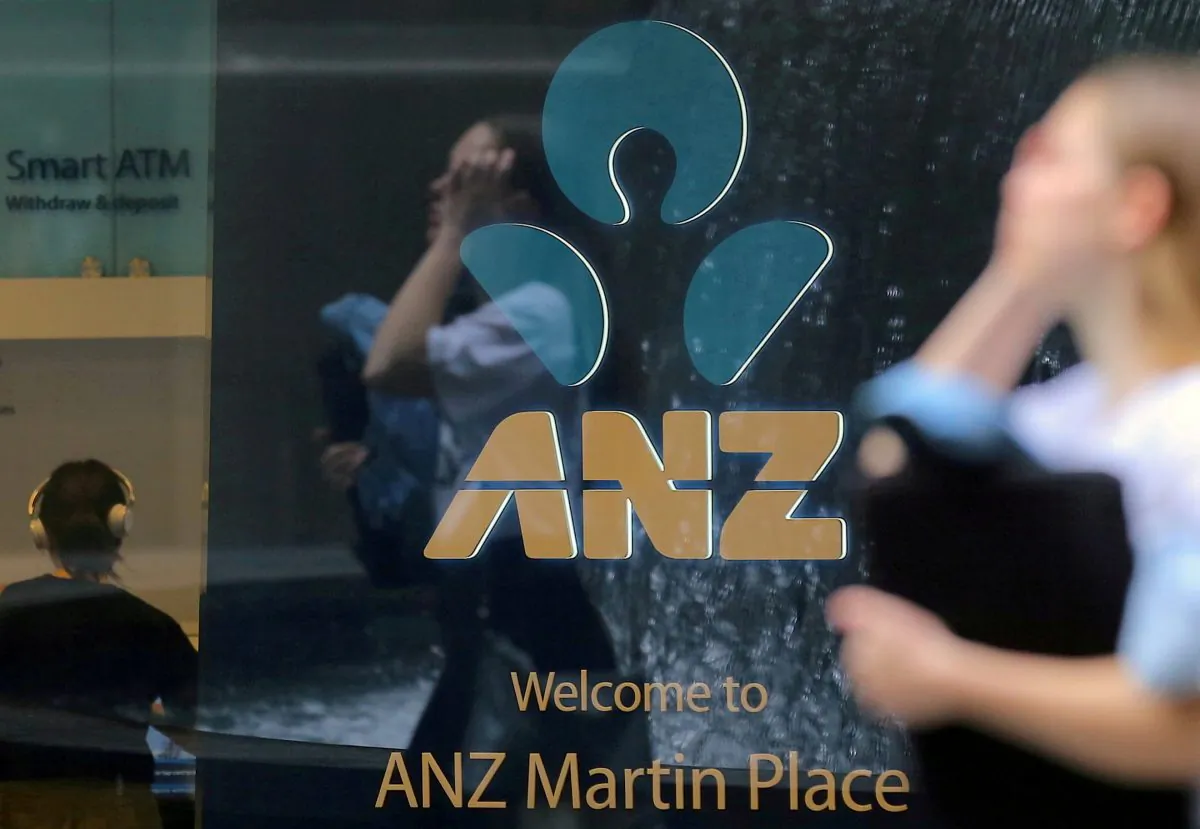 A pedestrian is reflected in the window of a branch of the Australia and New Zealand Banking Group (ANZ) in central Sydney, Australia, Oct. 25, 2017. (Reuters/Steven Saphore/File Photo)