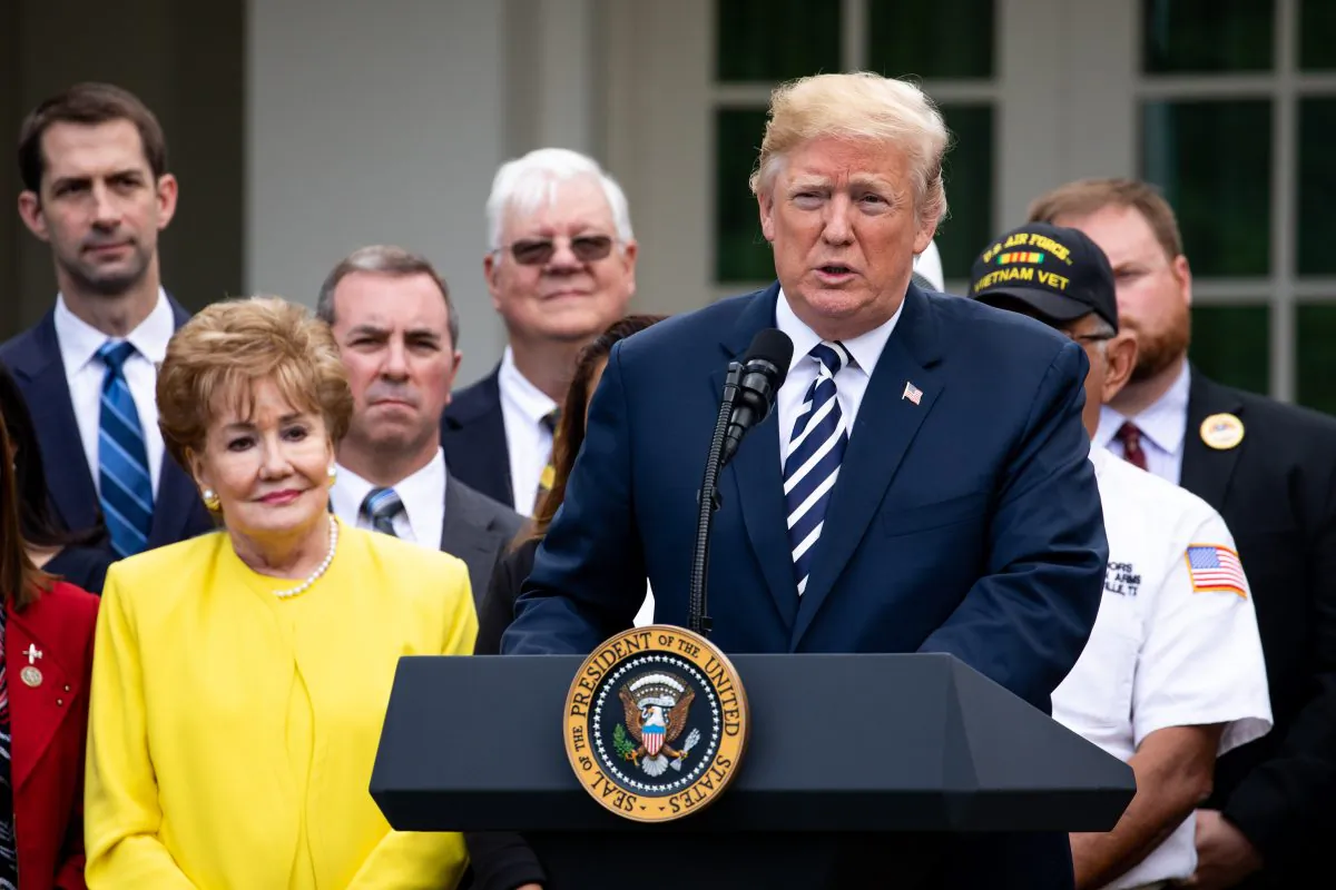 President Donald Trump participates in the signing ceremony for the VA Mission Act of 2018 in the Rose Garden of the White House in Washington on June 6, 2018. (Samira Bouaou/The Epoch Times)