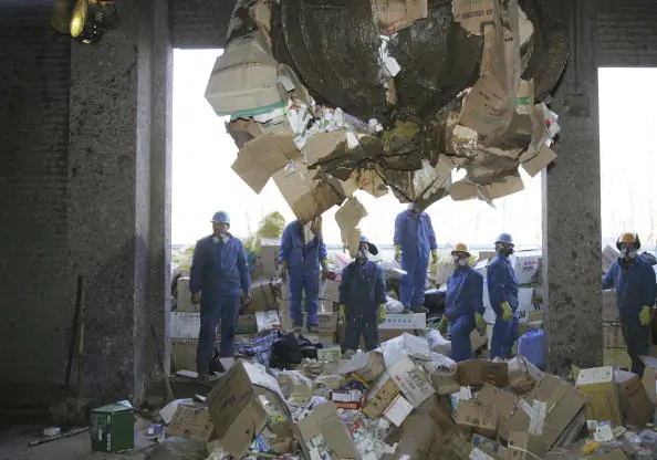 Workers destroy fake and outdated drugs in Beijing on Jan. 18, 2007. (China Photos/Getty Images)