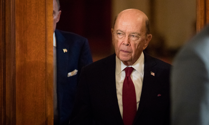 Secretary of Commerce Wilbur Ross enters the East Room of the White House in Washington on April 3, 2018. (Samira Bouaou/The Epoch Times)